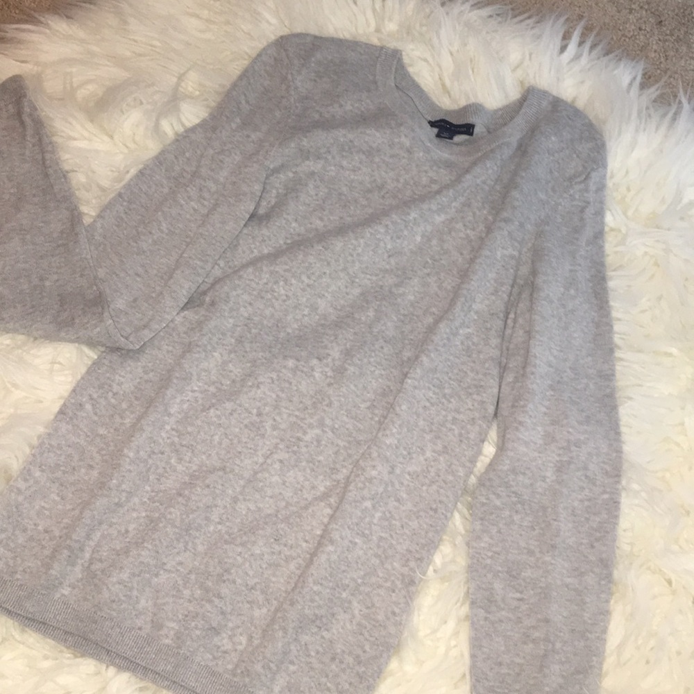 A gray Tommy Hilfiger sweater.
